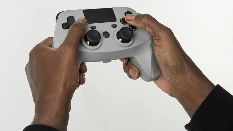 Hands holding video game controller (50811892858).jpg